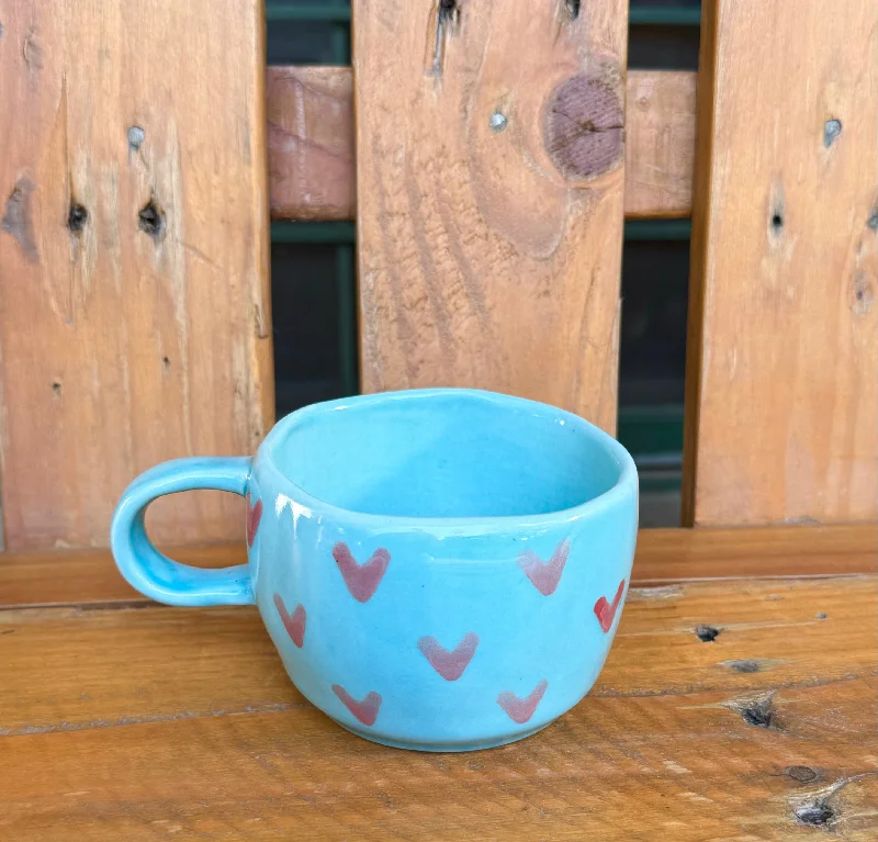 Designer double-wall espresso cups-Light blue wobbly mug with tiny pink hearts.