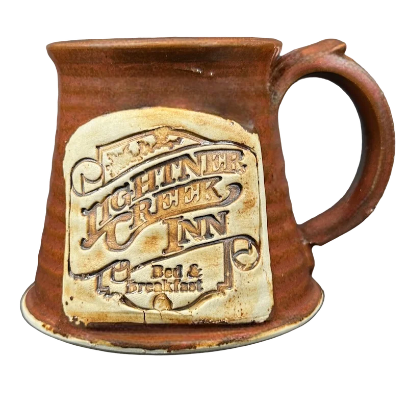 Vintage-inspired whiskey tumblers-Lightner Creek Inn Bed & Breakfast Signed Rust Pottery Mug